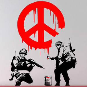 Banksy street art depicting a red peace sign painted by two heavily armed soldiers