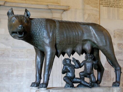 A bronze statue of a female wolf acting as nurse to the Roman baby twins, Romulus and Remus, who will be founders of Rome.