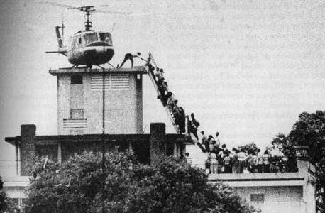People loading onto a helicopter on the roof of the US Embassy in Saigon