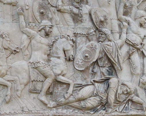 A sculpture relief from Trajan's column depicts warriors on horseback and on the ground.