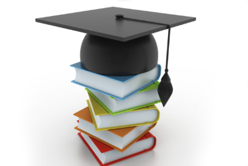 a stack of books with a graduate hat on top