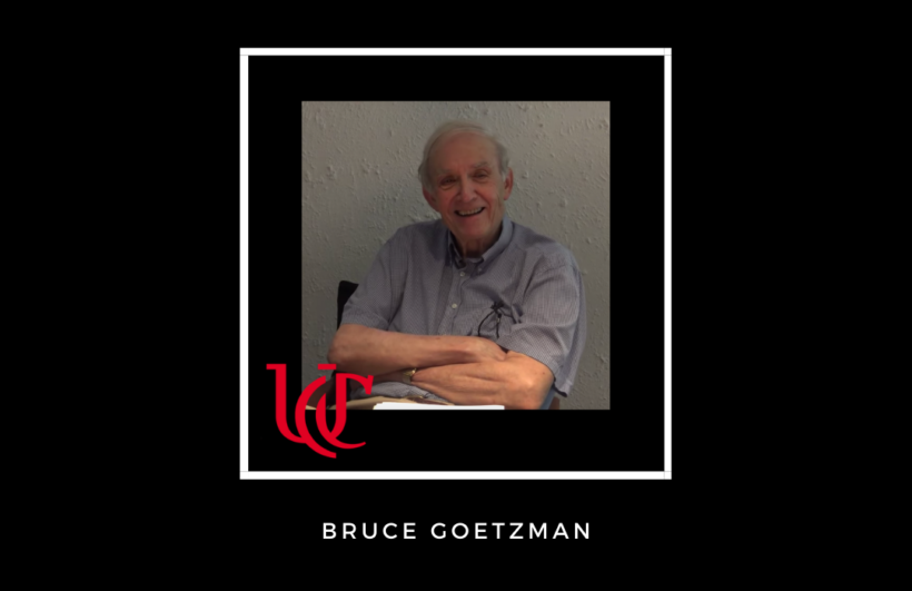 bruce goetzman seated with arms crossed
